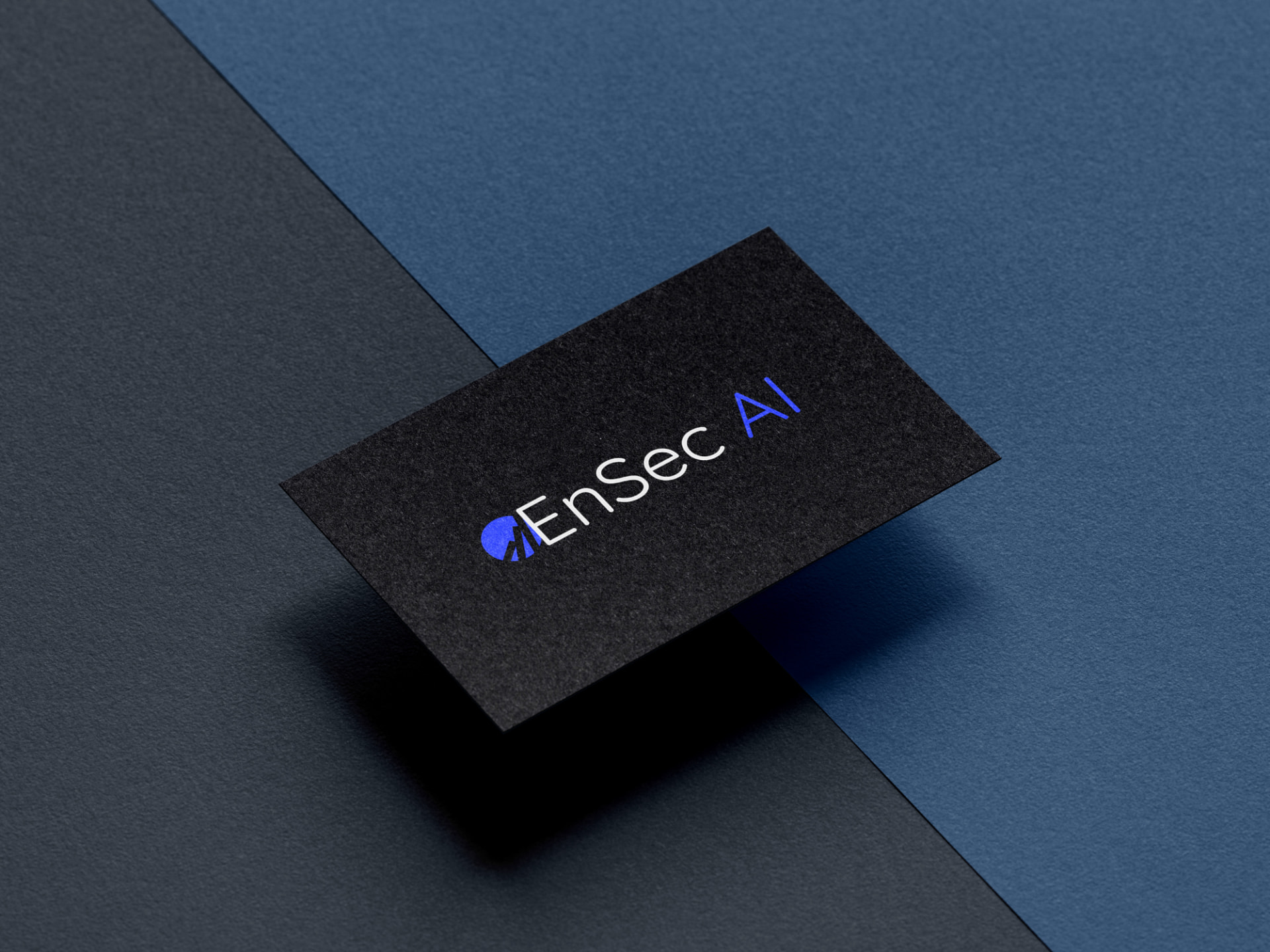 EnSec AI brand identity — logo on a dark business card against a blue background